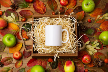 White coffee mug mockup with fall leave and pine cones