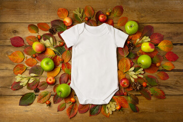 White baby short sleeve bodysuit mockup with fall leaves and pine cones