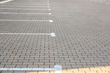 Fototapeta premium Empty parking lot with white marking lines