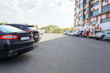 Fototapeta na wymiar Cars parked in parking lot outdoor