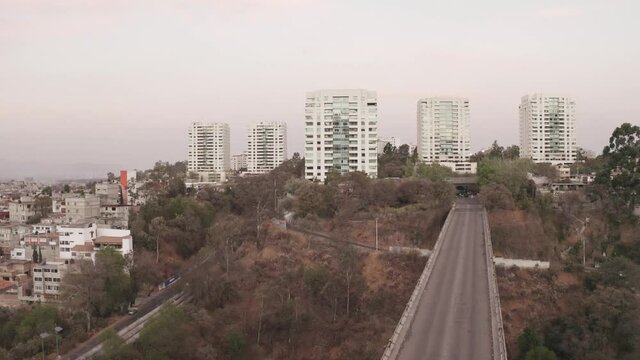 Aerial establishing shot flying over la enramada town at day