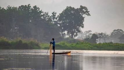 A woman fishing alone in the lake 
Beautiful Fresh water natural lake of Assam "Chandubi"