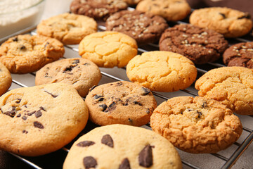 Grid with tasty homemade cookies on table, closeup