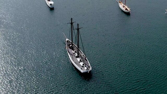 Sailboats Floating On Water Surface In Vineyard Haven Harbor In Cape Cod, Massachusetts. aerial tilt down
