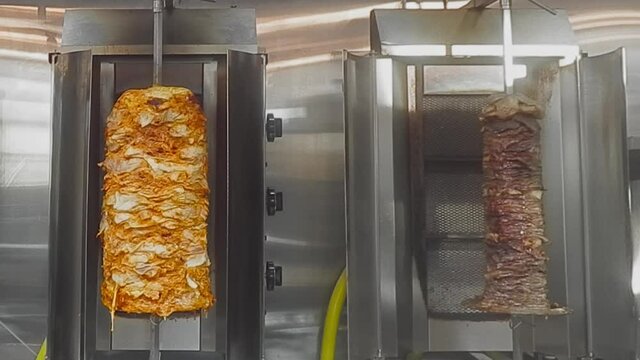 4k Loop1-4 Chicken Shawarma Vertical BBQ Rotisserie next to thinly sliced steaks stacks of sirloin triple 'A' Beef Shawarma rotating on a 360 degree spit in a stainless steel flamed upright grill.