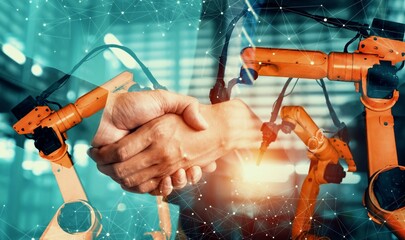 Mechanized industry robot arm and business handshake double exposure . Concept of successful...