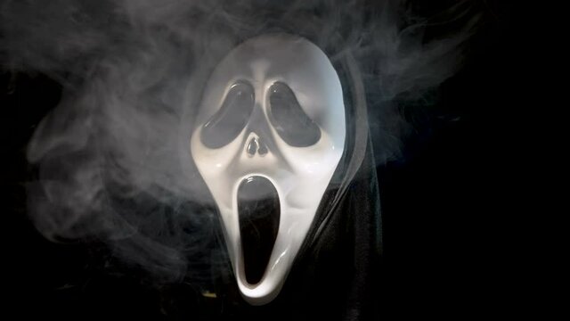 The white smoke coming out of the halloween mask inside the dark room in Estonia