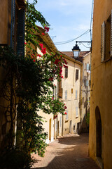 Traditional old houses on narrow winding streets in small french town of Hyeres in autumn