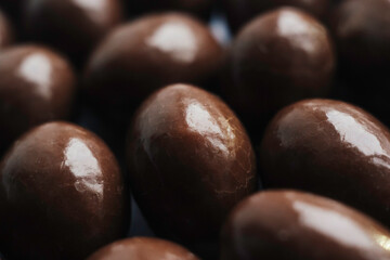 Round chocolate candies in glaze by a large clan. Walnut inside