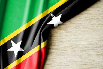 Saint Kitts and Nevis flag. Fabric pattern flag of Saint Kitts and Nevis. 3d illustration. with back space for text.