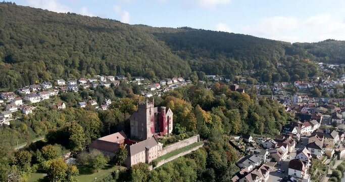 Aerial view of a crane shot of Zwingenberg Castle in the Neckar Valley on a sunny day.