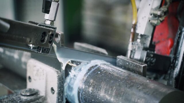 Cutting a Steel Rod with a Metal Sawer using Coolant Liquid - Slow Motion