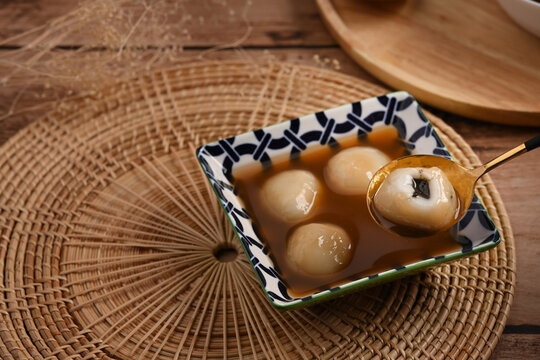 Sticky Rice Balls With Grounded Black Sesame In Sweet Ginger Soup.