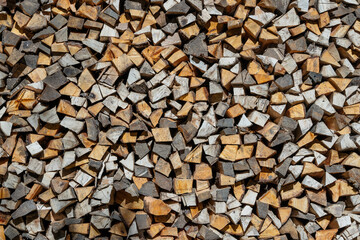 Stack of firewood, wooden abstract background, close up