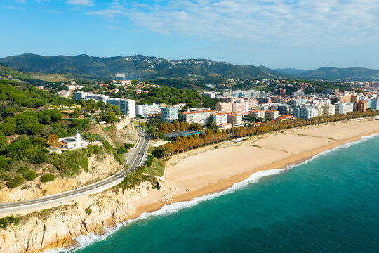 Aerial photo of Spanish town Calella with view of beach and residential buildings.