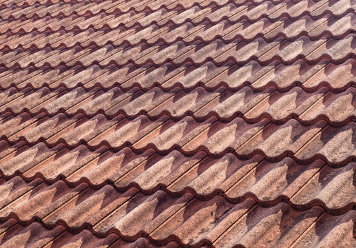 An image of an old tiled roof of an old house or residence to renovate as a background image.
