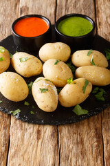 Papas arrugadas wrinkly potatoes is a traditional boiled potato dish served with a mojo rojo and...
