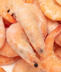 Red frozen shrimp as background.
