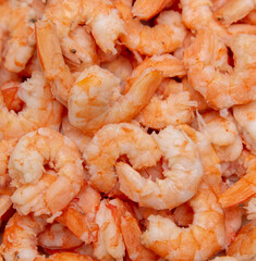 Peeled red shrimp meat as background.