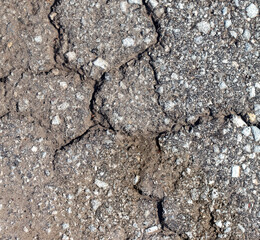 Old cracked asphalt as an abstract background.