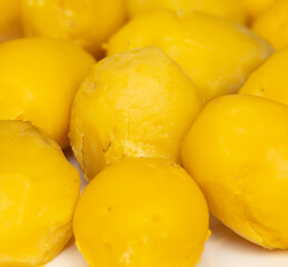 Peeled boiled potatoes as a background.