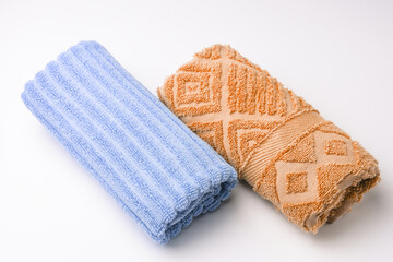 Clean colored towels on a light background. Top view.