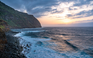 Sunset on the coast at the Town Porto Moniz