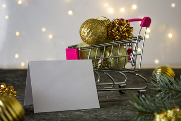 Blank christmas card on table and christmas decorations. Space for text