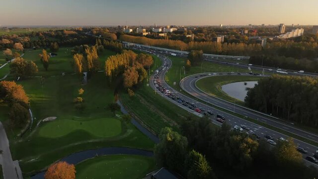 Amsterdan north intersection between N247 and the A10 Ringweg north, the highway where evening rush hour traffic stands on the highway. Commuters going home.