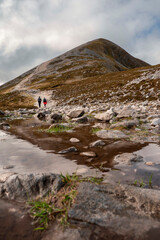 Couple of women walking on a path to the top of Croagh Patrick mountain. County Mayo, Ireland....