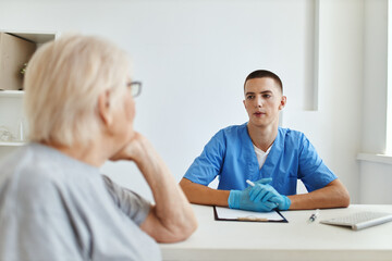 Fototapeta premium the patient is examined by a doctor A visit to the hospital
