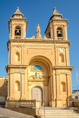 Fototapeta na wymiar View at the Chruch of Our Lady of Pompei in the streets of Marsaxlokk - Malta
