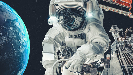 Astronaut spaceman do spacewalk while working for spaceflight mission at space station . Astronaut wear full spacesuit for operation . Elements of this image furnished by NASA space astronaut photos .