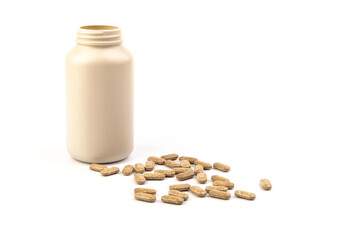 Plastic bottle of Nutrition supplements, brown vitamin pills on white background.