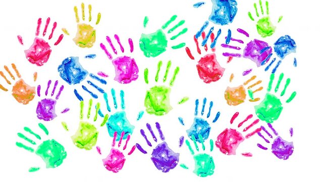 Prints of painted children's palms background. Colored hand drawings on a white wall. Bright, cheerful, festive, childish positive background.