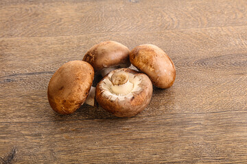Raw brown champignons mushroom heap