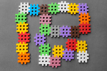 Multicolored puzzles on a gray background
