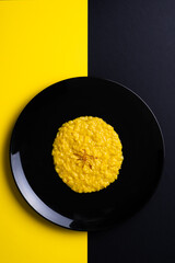 saffron risotto on dark background