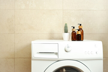 Concept of housework with washing machine in bathroom