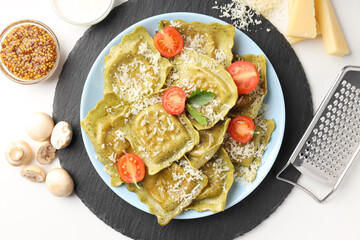 Delicious food concept with ravioli on white background