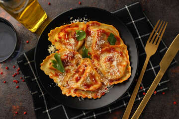 Obraz na płótnie Canvas Delicious food concept with ravioli on textured background