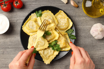 Delicious food concept with ravioli on textured background