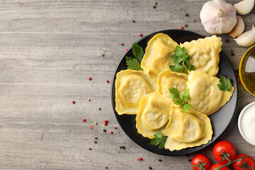 Delicious food concept with ravioli on textured background
