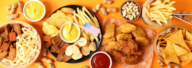 Concept of Super bowl snacks on orange  background