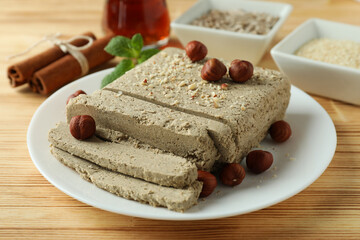 Concept of tasty food with halva on wooden background