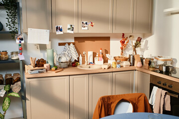 Image of cupboard with kitchen utensil in domestic kitchen at home