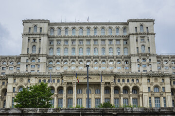Fototapeta premium Palace of the Parliament (Palatul Parlamentului) building in Socialist realist Neoclassical architectural forms. Palace reaches a height of 84 meters. Bucharest, capital city of Romania.
