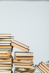 stacks of educational books in the college library on a white background