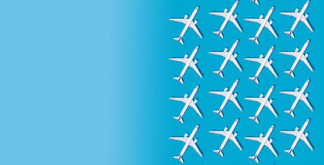 Christmas background. Christmas tree from planes. Postcard for airlines. An airport. Blue background with place for text Copy space. Pattern from planes on a blue background. Fly airline. Airplane