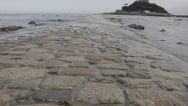 Part Submerged Cobbled Path to St Michael's Mount Low Shot - Slow Motion